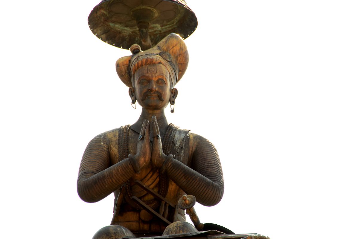 Kathmandu Bhaktapur 02-3 Bhaktapur Durbar Square King Bhupatindra Malla Column Close Up King Bhupatindra Malla sits on top of a column facing the Golden Gate in Bhaktapur Durbar Square.